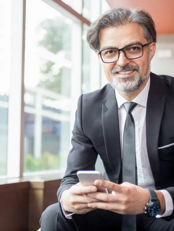 Professional using the TotalX payroll application on a smartphone